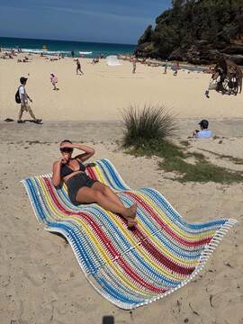 Bronte lying on towel