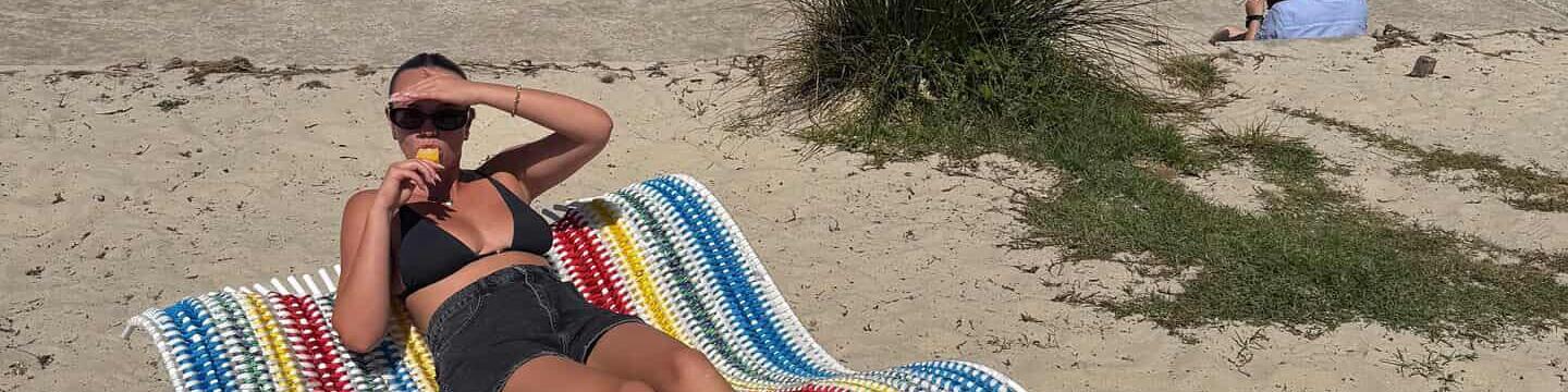 Bronte lying on towel